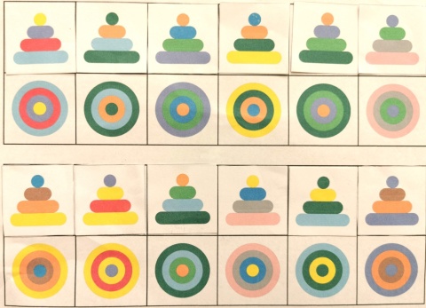 Rozwiązana karta pracy – dopasowanie widoku z boku piramid do widoku z góry, naklejone kolorowe elementy